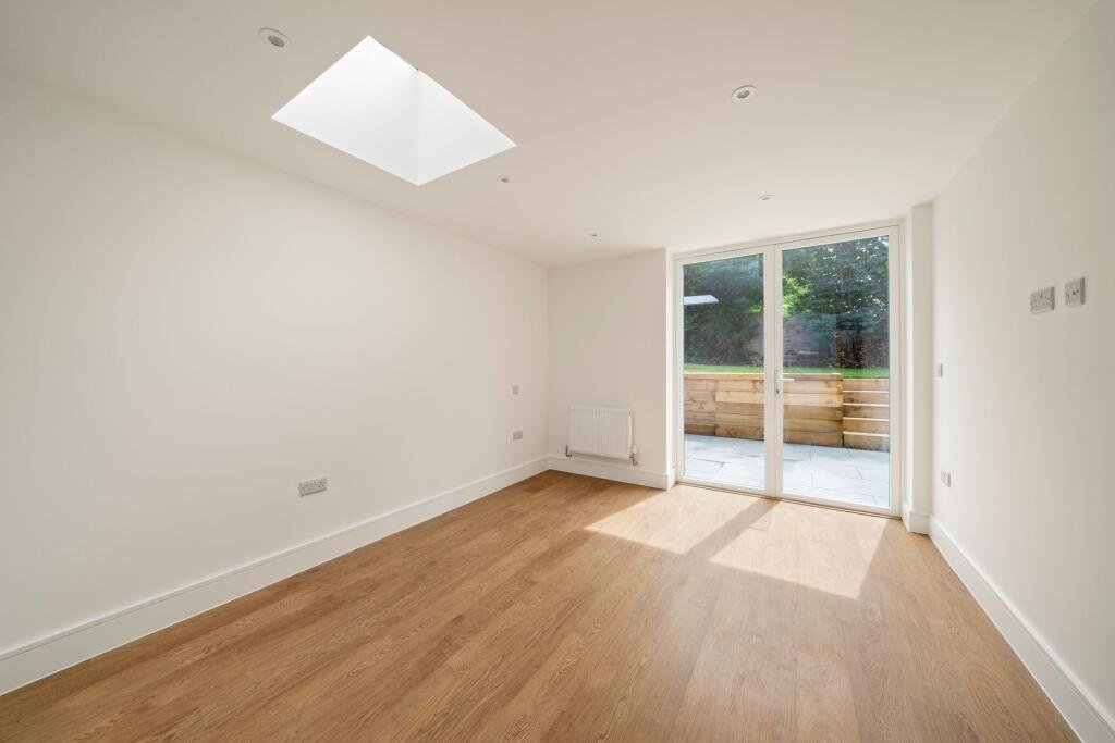 A tiny one bedroom brick cabin in Effingham is on sale for £475k, over £200k above the UK average, offering modern design, a private garden and eco friendly features.