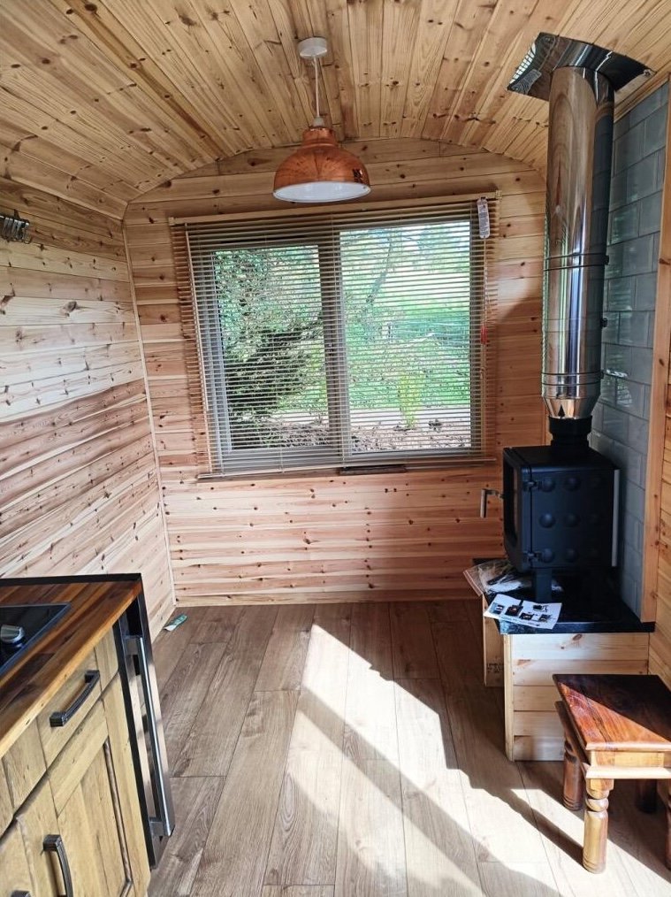 Charming £100,000 wooden shepherd’s hut near Penryn offers meadowland, pond, log fire and stunning countryside views, ideal as a retreat, glamping or holiday let.
