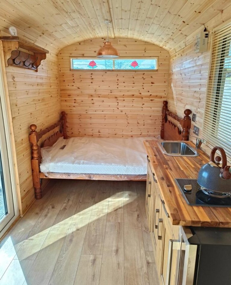 Charming £100,000 wooden shepherd’s hut near Penryn offers meadowland, pond, log fire and stunning countryside views, ideal as a retreat, glamping or holiday let.