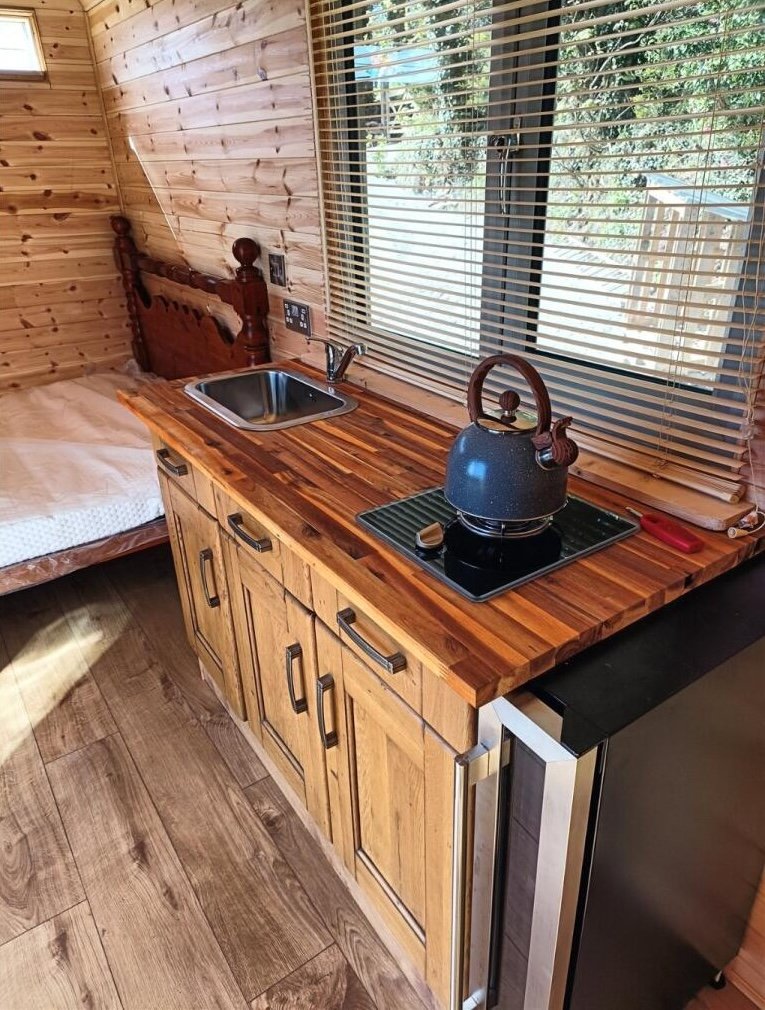 Charming £100,000 wooden shepherd’s hut near Penryn offers meadowland, pond, log fire and stunning countryside views, ideal as a retreat, glamping or holiday let.