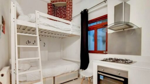 Tiny £2,070 a month Farringdon studio flat shocks with bunk beds in the kitchen. The quirky bedsit fits three tenants and is located near tube stations and amenities.