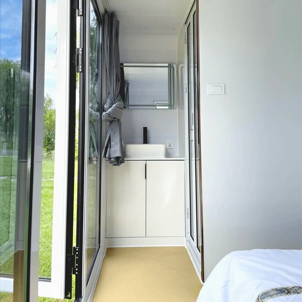 Tiny houses for just over £10k are now available online. Chery Industrial offers a flat-pack style cabin with bed, shower, and workspace delivered to your door.