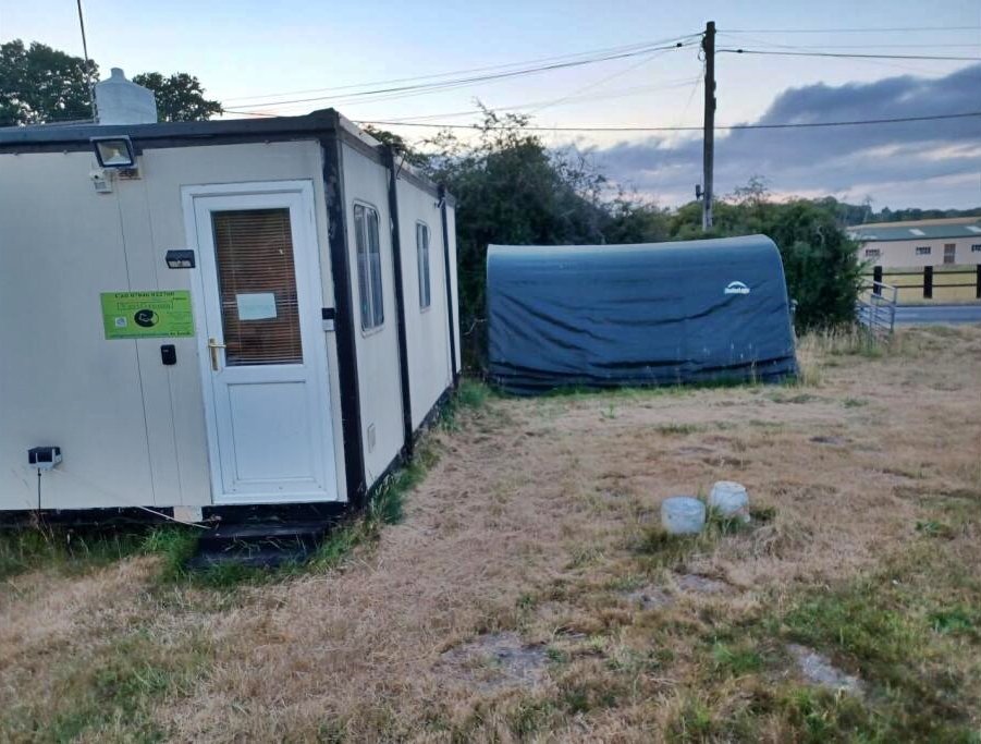 Charming 17th century Dorset cottage for £785,000 with four bedrooms, hot tub, Tiki bar and grazing land - but quirky photos reveal bare feet on show in the listing.