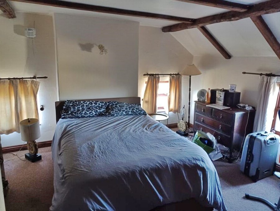Charming 17th century Dorset cottage for £785,000 with four bedrooms, hot tub, Tiki bar and grazing land - but quirky photos reveal bare feet on show in the listing.