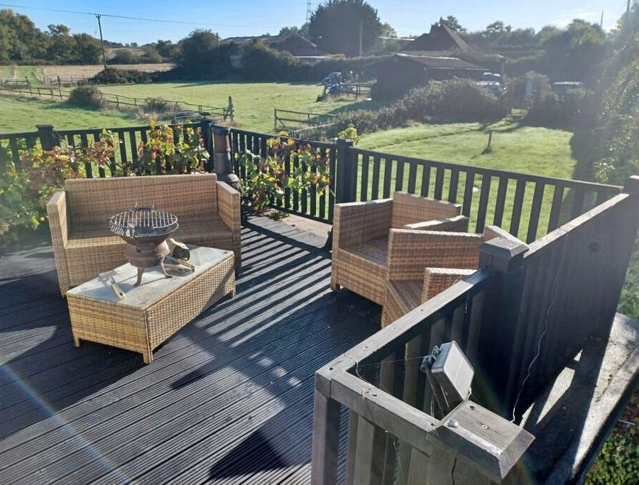 Charming 17th century Dorset cottage for £785,000 with four bedrooms, hot tub, Tiki bar and grazing land - but quirky photos reveal bare feet on show in the listing.