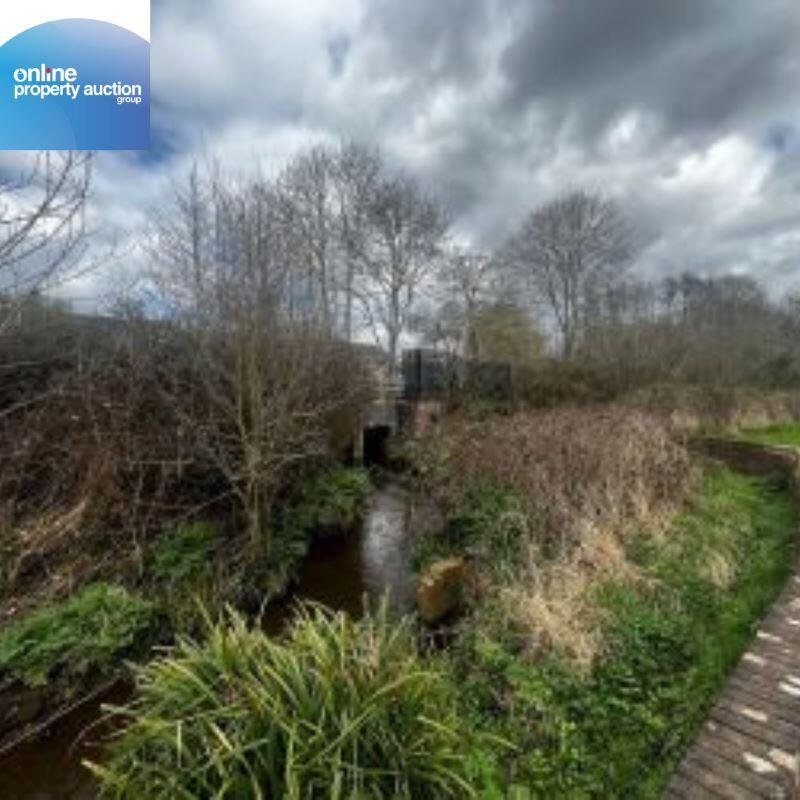 Unusual plot in Romsey with stream leading to Tadburn Lake up for auction at £4,950. Scenic freehold land near nature reserve offers potential uses subject to planning.