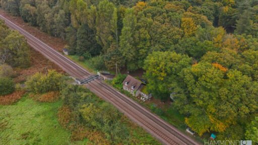 A £300,000 two-bedroom cottage in Norfolk offers rustic charm and woodland seclusion just feet from train tracks, blending period character with unique rural living.