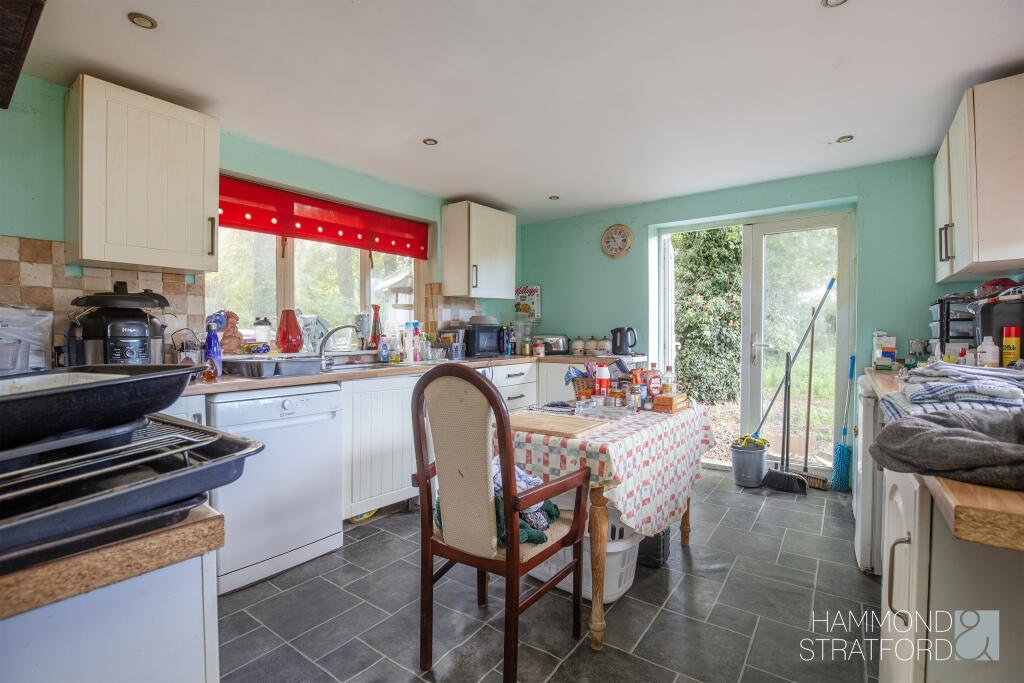 A £300,000 two-bedroom cottage in Norfolk offers rustic charm and woodland seclusion just feet from train tracks, blending period character with unique rural living.