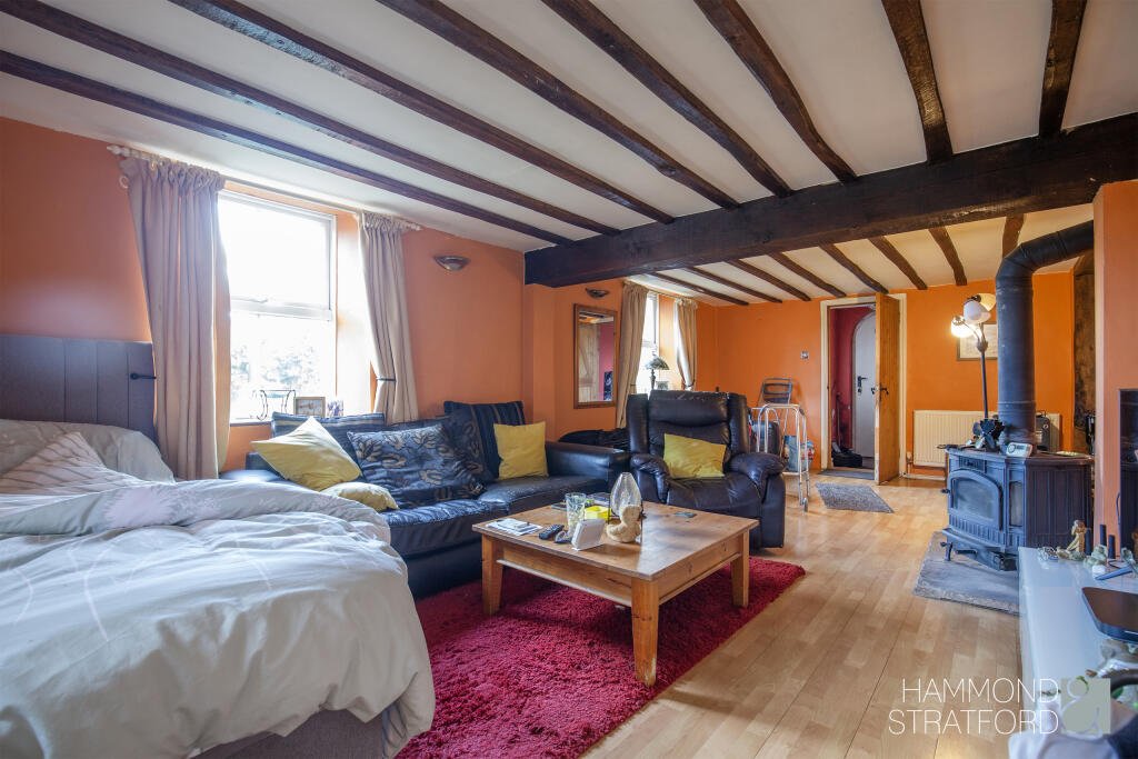 A £300,000 two-bedroom cottage in Norfolk offers rustic charm and woodland seclusion just feet from train tracks, blending period character with unique rural living.