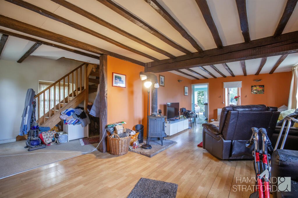 A £300,000 two-bedroom cottage in Norfolk offers rustic charm and woodland seclusion just feet from train tracks, blending period character with unique rural living.