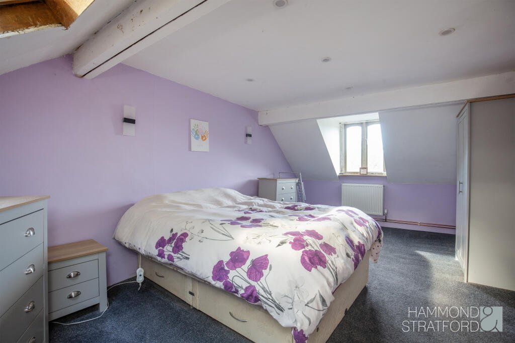 A £300,000 two-bedroom cottage in Norfolk offers rustic charm and woodland seclusion just feet from train tracks, blending period character with unique rural living.