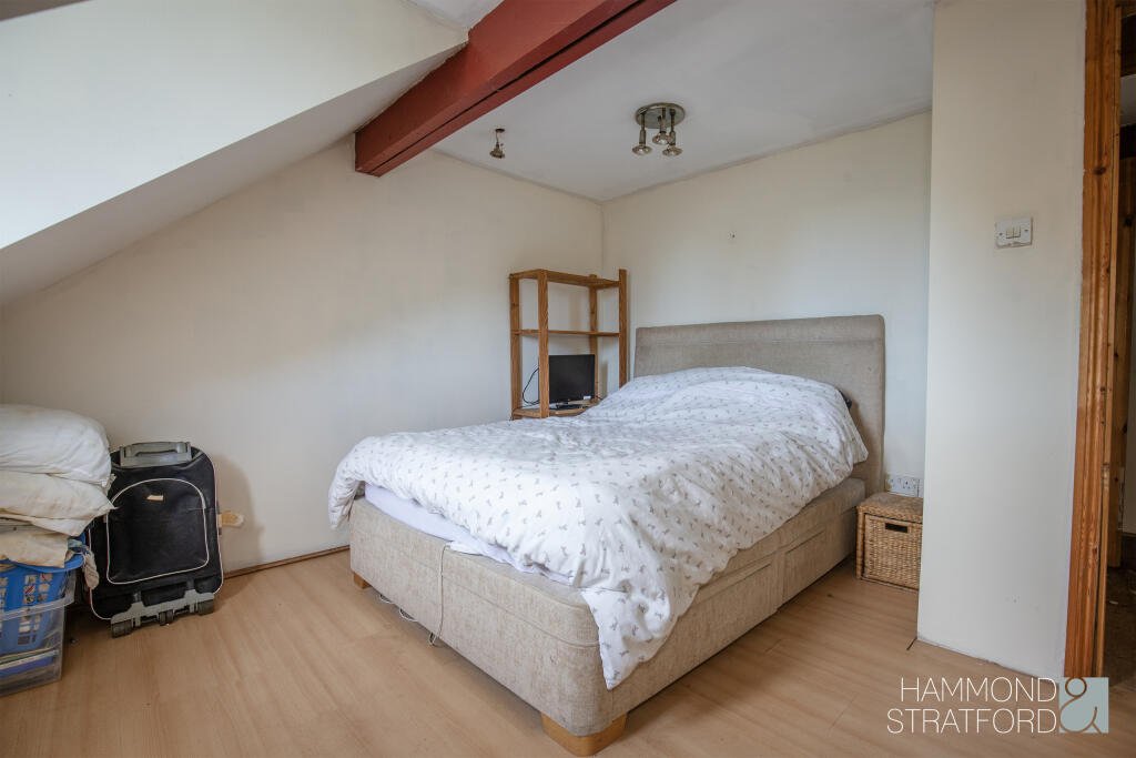 A £300,000 two-bedroom cottage in Norfolk offers rustic charm and woodland seclusion just feet from train tracks, blending period character with unique rural living.