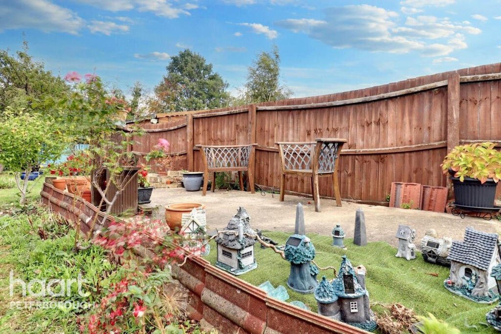 Unassuming three-bed home in Peterborough listed at £240,000 hides a striking Coca Cola themed lounge with bold red walls, memorabilia, and unique retro inspired decor.