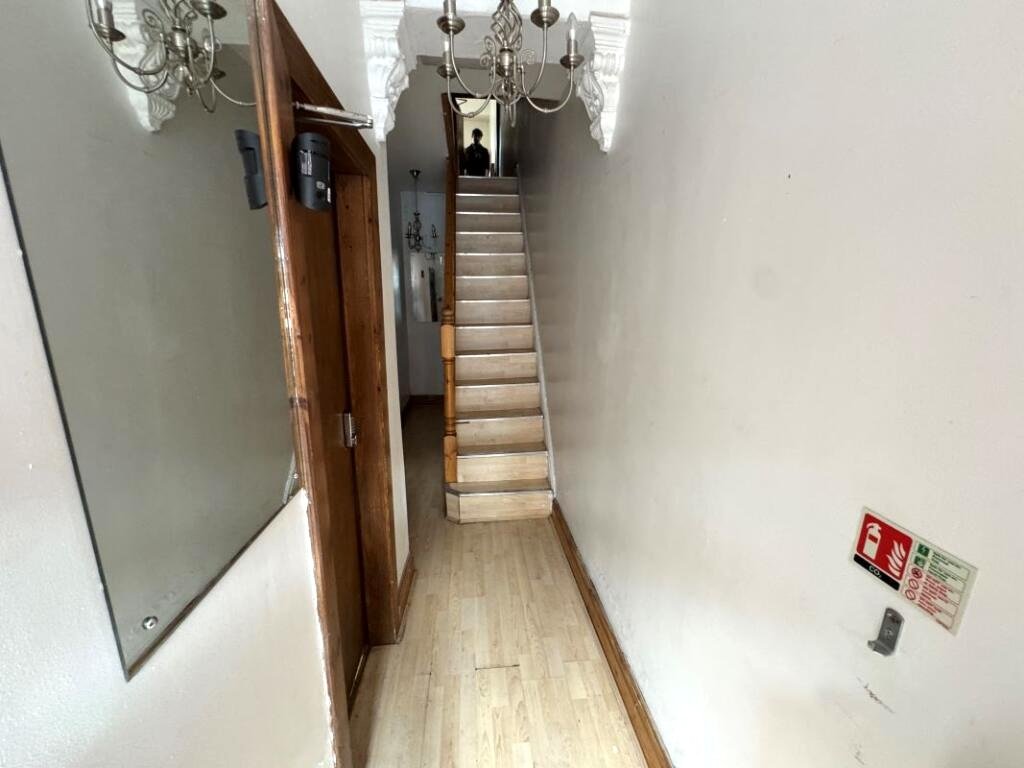 A Manchester student house with six bedrooms is on auction for £200,000, featuring private kitchens in each room near the University of Manchester and the famous Curry Mile.