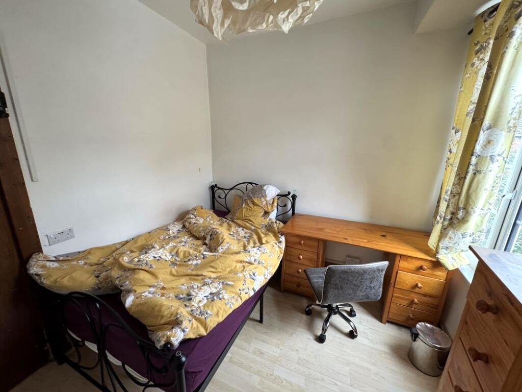 A Manchester student house with six bedrooms is on auction for £200,000, featuring private kitchens in each room near the University of Manchester and the famous Curry Mile.