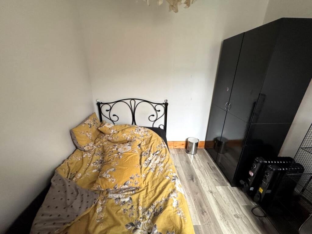 A Manchester student house with six bedrooms is on auction for £200,000, featuring private kitchens in each room near the University of Manchester and the famous Curry Mile.