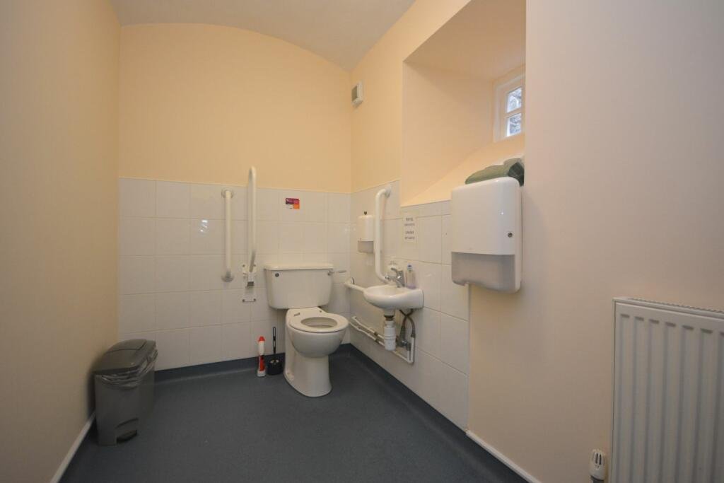 A former police station in Dolgellau with four original cells and three courtyards is on the market for £95,000, offering quirky charm and conversion potential.
