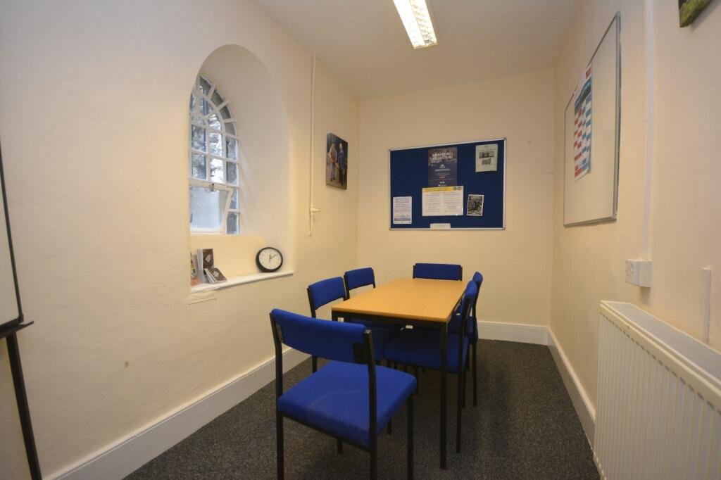 A former police station in Dolgellau with four original cells and three courtyards is on the market for £95,000, offering quirky charm and conversion potential.