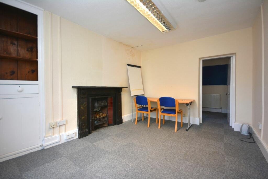 A former police station in Dolgellau with four original cells and three courtyards is on the market for £95,000, offering quirky charm and conversion potential.