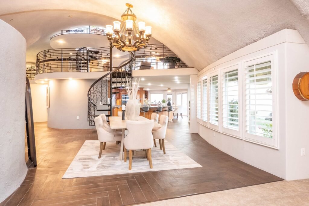 A $3 million California mountain home resembling The Flintstones’ Bedrock is up for sale, featuring domed architecture, a rock-carved pool, and breathtaking panoramic views.