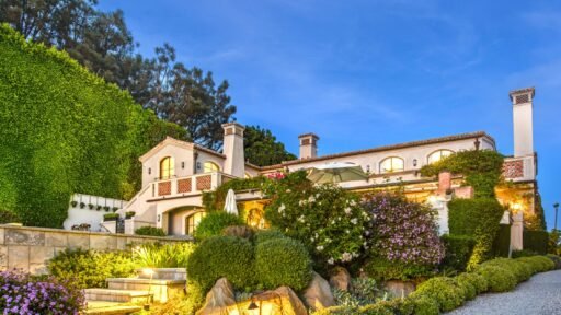 A $29.9m Malibu mansion in the exclusive Serra Retreat offers ocean views, Italianate gardens, a tennis court, infinity pool, guest house, and timeless European elegance.