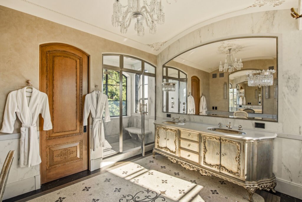 A $29.9m Malibu mansion in the exclusive Serra Retreat offers ocean views, Italianate gardens, a tennis court, infinity pool, guest house, and timeless European elegance.