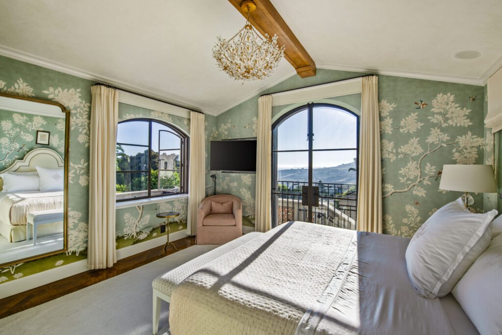 A $29.9m Malibu mansion in the exclusive Serra Retreat offers ocean views, Italianate gardens, a tennis court, infinity pool, guest house, and timeless European elegance.