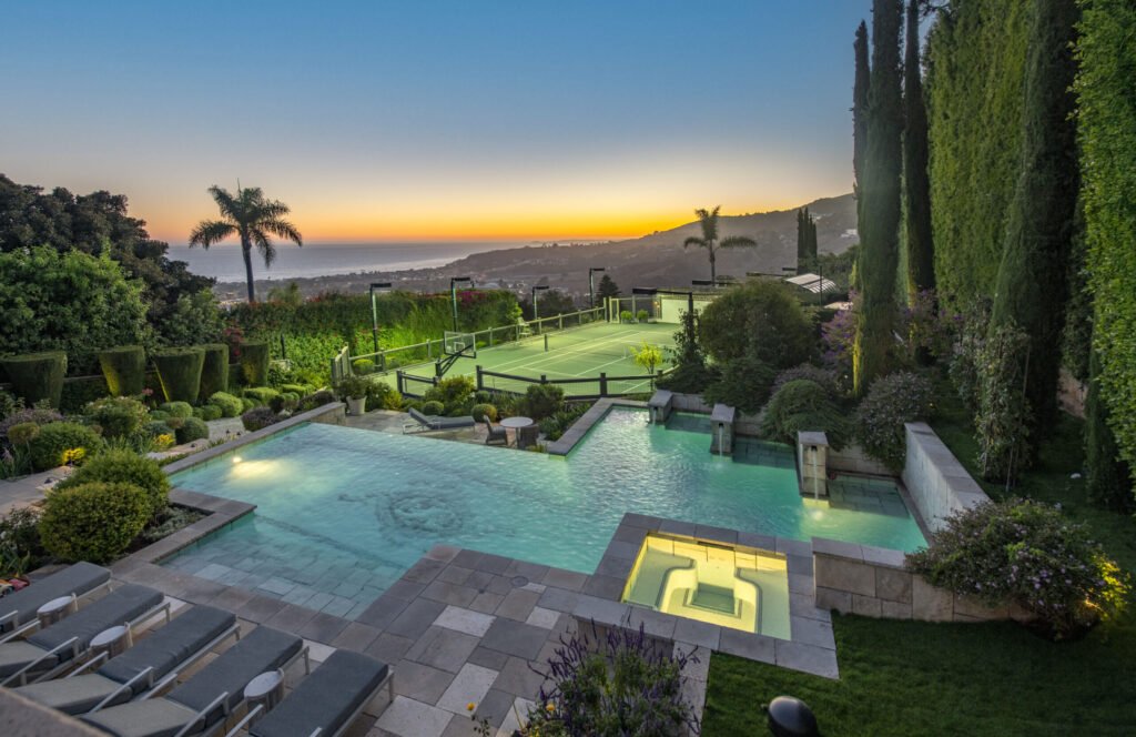 A $29.9m Malibu mansion in the exclusive Serra Retreat offers ocean views, Italianate gardens, a tennis court, infinity pool, guest house, and timeless European elegance.