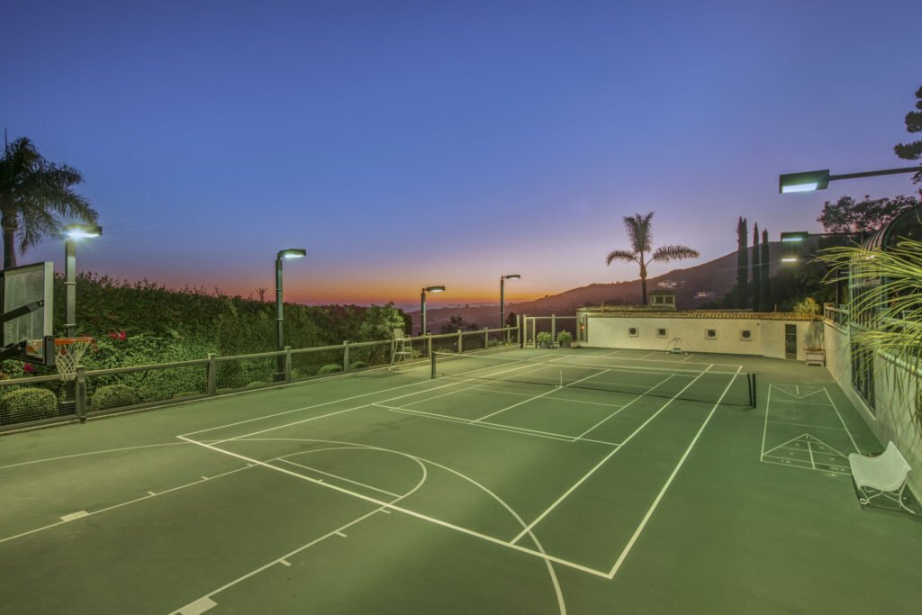 A $29.9m Malibu mansion in the exclusive Serra Retreat offers ocean views, Italianate gardens, a tennis court, infinity pool, guest house, and timeless European elegance.