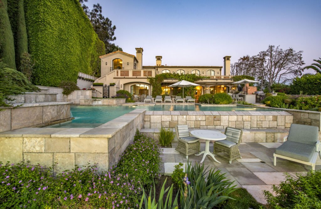 A $29.9m Malibu mansion in the exclusive Serra Retreat offers ocean views, Italianate gardens, a tennis court, infinity pool, guest house, and timeless European elegance.