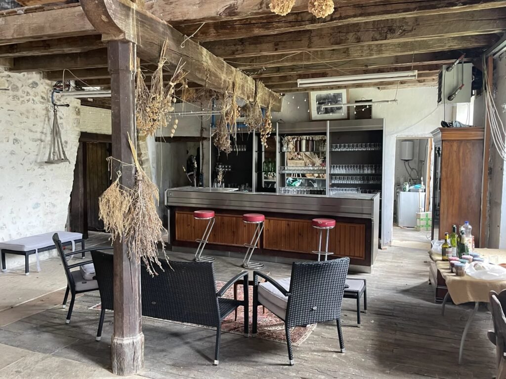 An enchanting private island chateau near Toulouse is for sale for £653,572, featuring 12 rooms, a riverside terrace, a pub, olive grove, and conversion potential.