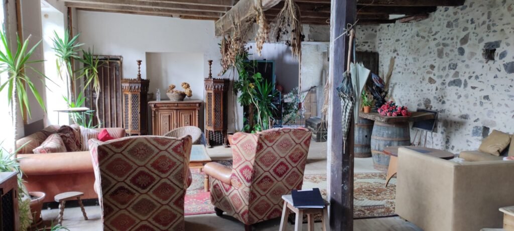 An enchanting private island chateau near Toulouse is for sale for £653,572, featuring 12 rooms, a riverside terrace, a pub, olive grove, and conversion potential.