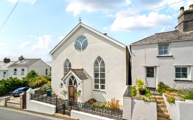 A converted chapel in Bere Alston offers heavenly charm with arched windows, an organ, and a garden called the Vicar’s Rest - listed for £450,000 by Bradleys Estate Agents.