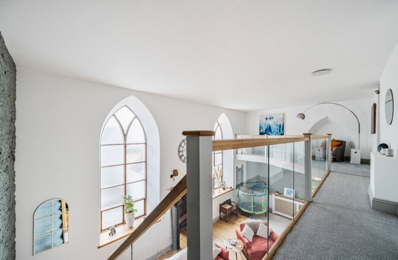 A converted chapel in Bere Alston offers heavenly charm with arched windows, an organ, and a garden called the Vicar’s Rest - listed for £450,000 by Bradleys Estate Agents.