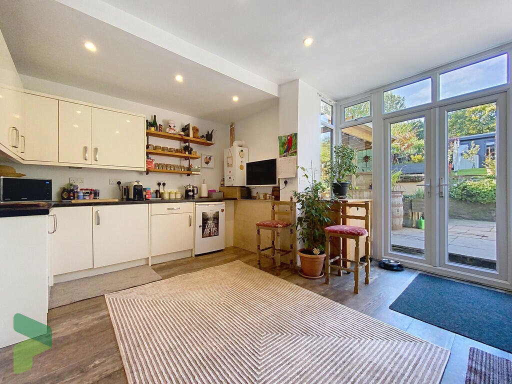 A three-bedroom home in Darwen hides a colorful secret inside – it’s a parrot paradise with bird cages, tropical plants, and even a tree at its heart, listed for £285,000.