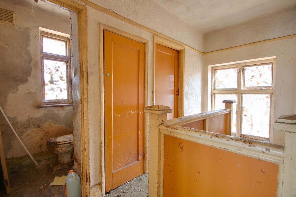 A three-bedroom house in Eastleigh buried under rubbish and cobwebs is on sale for £180,000, offering brave buyers a full renovation project with huge potential.