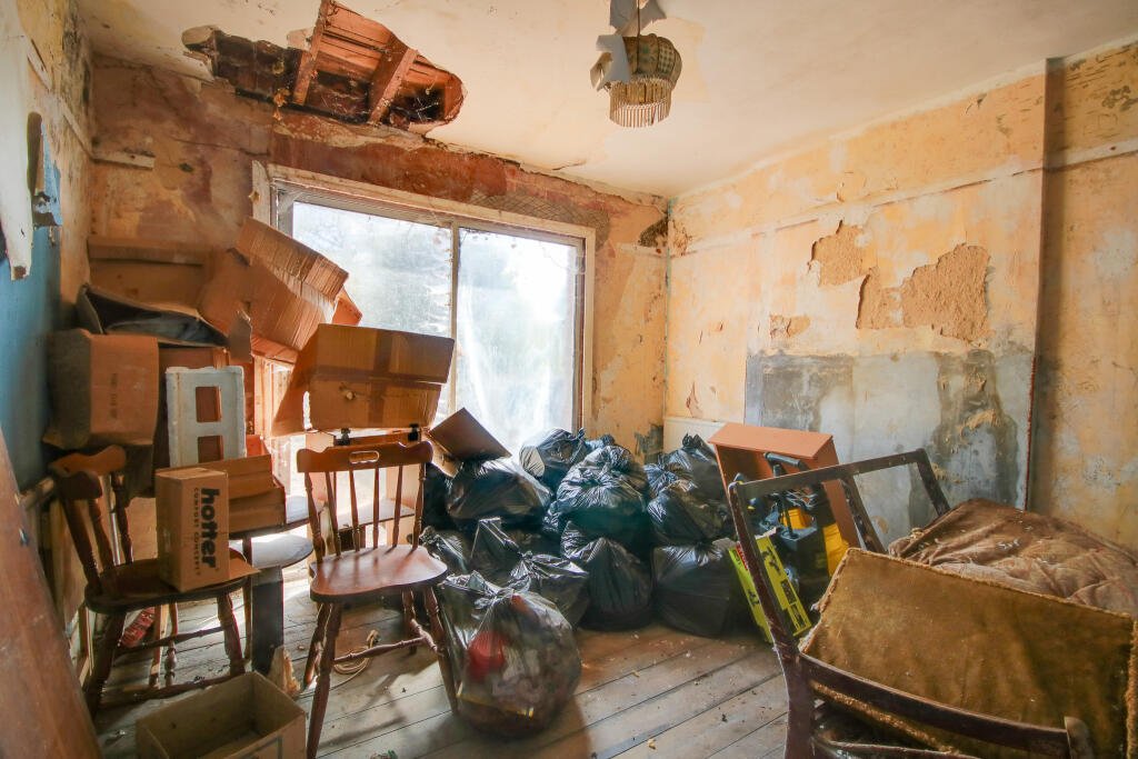A three-bedroom house in Eastleigh buried under rubbish and cobwebs is on sale for £180,000, offering brave buyers a full renovation project with huge potential.