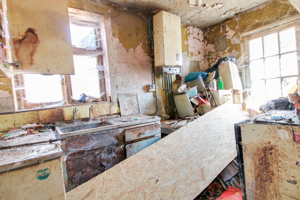 A three-bedroom house in Eastleigh buried under rubbish and cobwebs is on sale for £180,000, offering brave buyers a full renovation project with huge potential.
