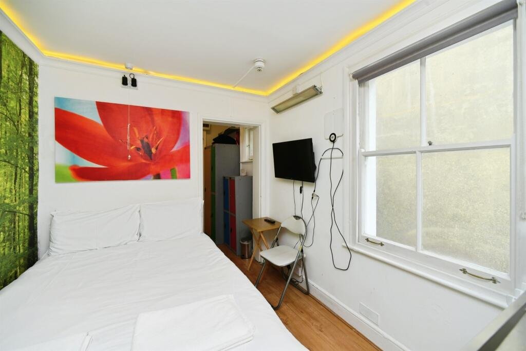 A Brighton studio flat so small you can cook from bed is on sale for £110,000, offering a compact seafront retreat with a kitchen, shower room and shared freehold.
