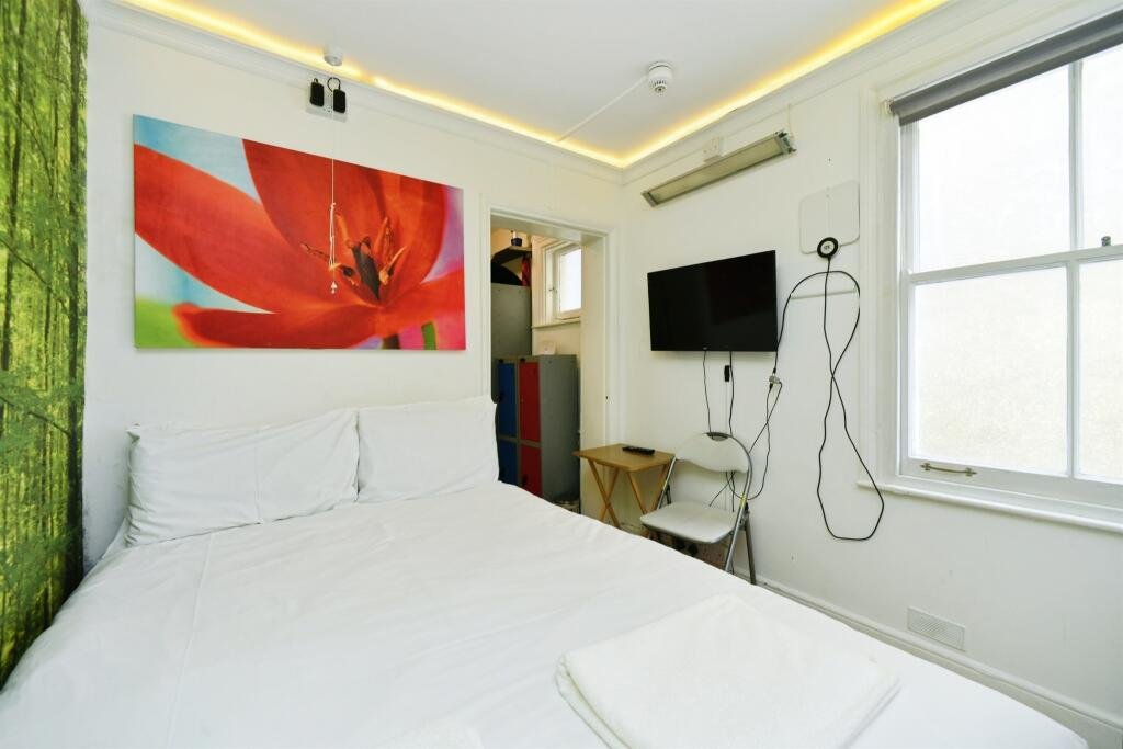 A Brighton studio flat so small you can cook from bed is on sale for £110,000, offering a compact seafront retreat with a kitchen, shower room and shared freehold.