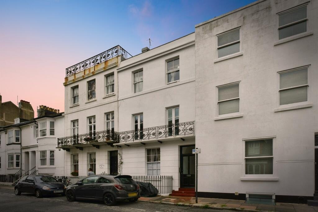 A Brighton studio flat so small you can cook from bed is on sale for £110,000, offering a compact seafront retreat with a kitchen, shower room and shared freehold.