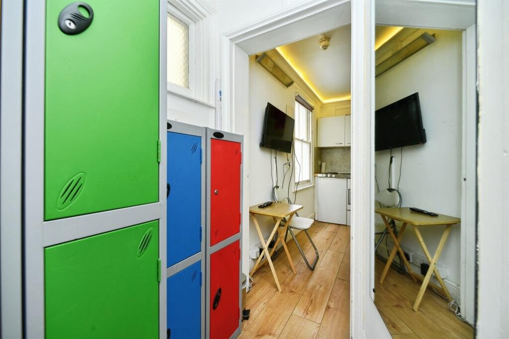 A Brighton studio flat so small you can cook from bed is on sale for £110,000, offering a compact seafront retreat with a kitchen, shower room and shared freehold.