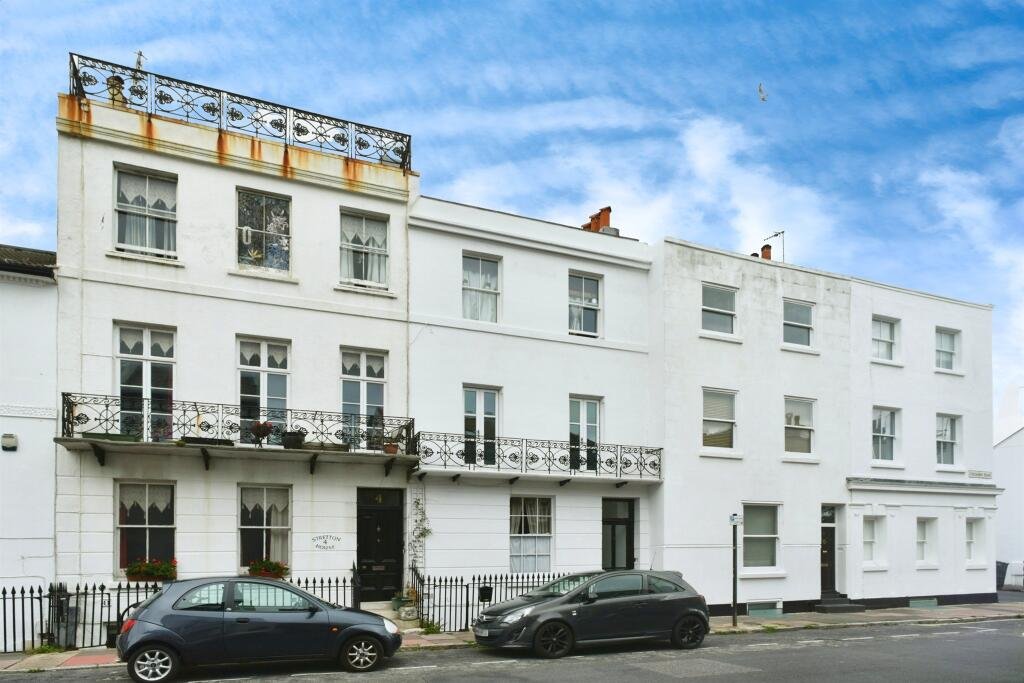 A Brighton studio flat so small you can cook from bed is on sale for £110,000, offering a compact seafront retreat with a kitchen, shower room and shared freehold.