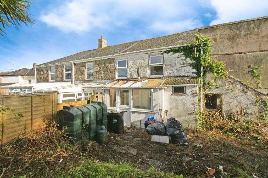 A two-bedroom cottage in Cornwall priced at £90,000 is drawing attention after photos revealed a mysterious skull on the fireplace amid its abandoned, timeworn interior.