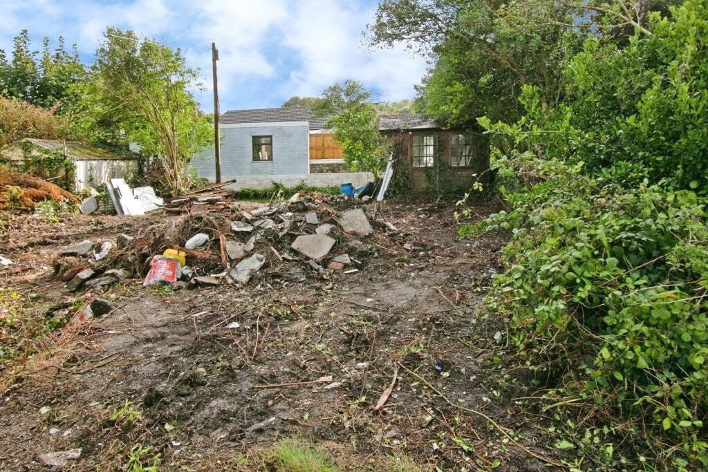 A two-bedroom cottage in Cornwall priced at £90,000 is drawing attention after photos revealed a mysterious skull on the fireplace amid its abandoned, timeworn interior.