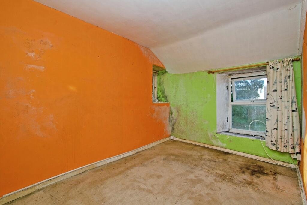 A two-bedroom cottage in Cornwall priced at £90,000 is drawing attention after photos revealed a mysterious skull on the fireplace amid its abandoned, timeworn interior.