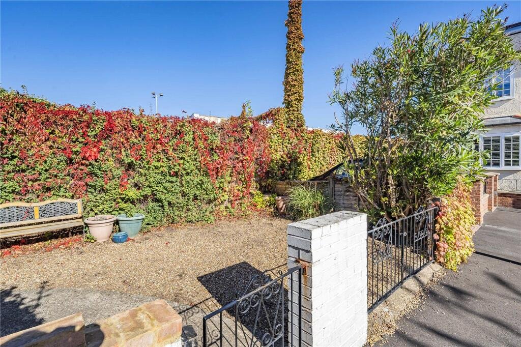 A parking space next to wheelie bins in Wimbledon is on sale for £22,500. The gated gravel spot near Wimbledon station is described as secure and priced for a quick sale.