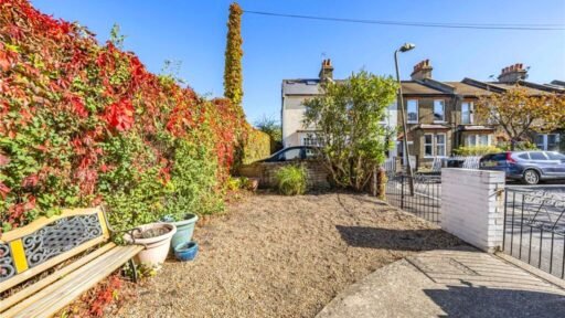 A parking space next to wheelie bins in Wimbledon is on sale for £22,500. The gated gravel spot near Wimbledon station is described as secure and priced for a quick sale.