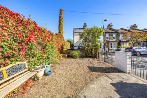 A parking space next to wheelie bins in Wimbledon is on sale for £22,500. The gated gravel spot near Wimbledon station is described as secure and priced for a quick sale.