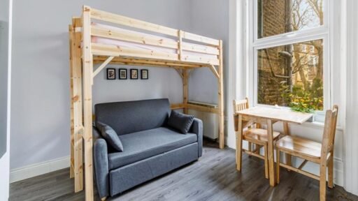 A cramped Kensington studio with a bunk bed over a sofa and a kitchenette just inches away is renting for £1,400 a month, with all bills and a £30 water charge extra.
